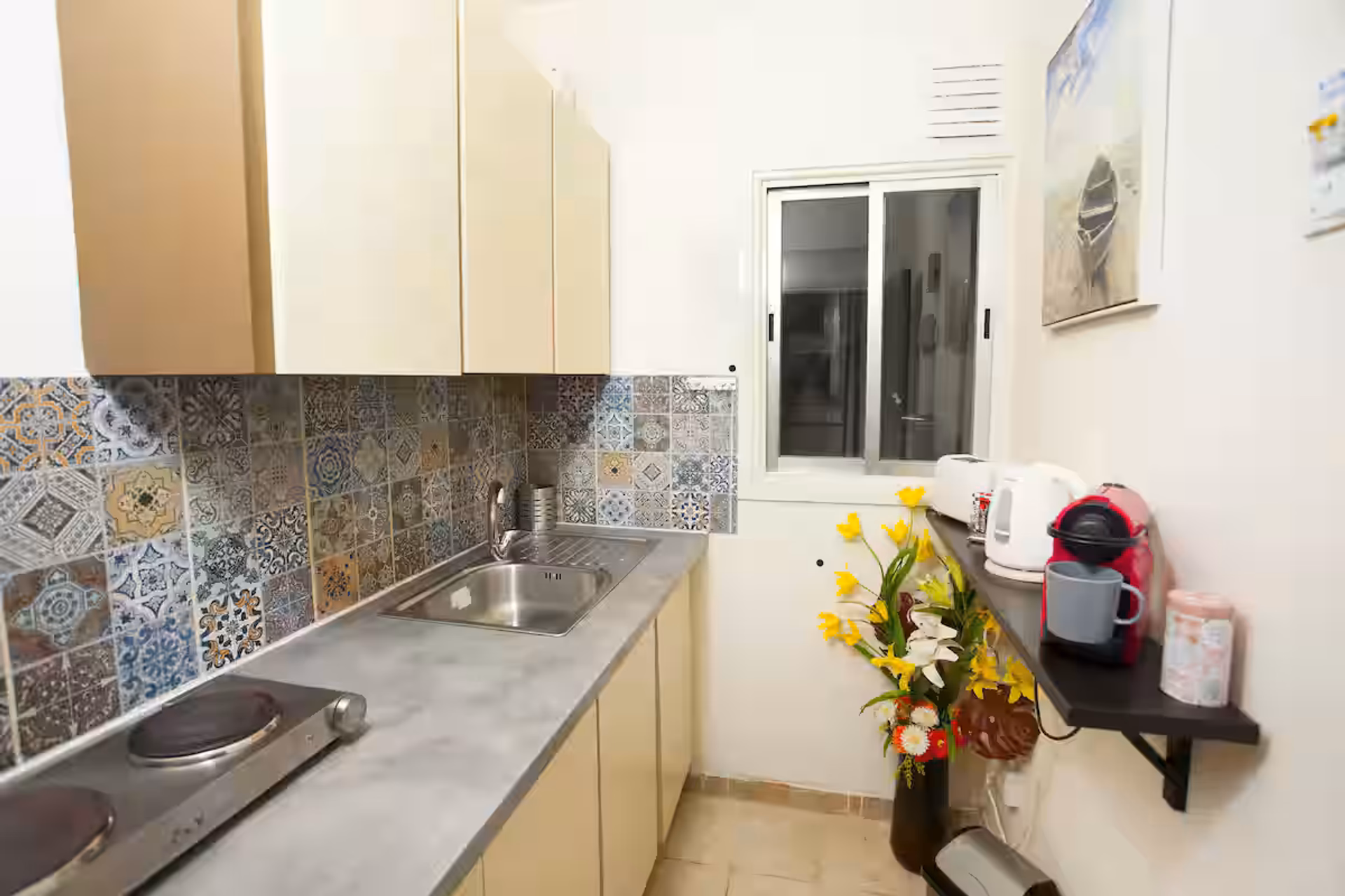 Kitchen with colorful tile backsplash