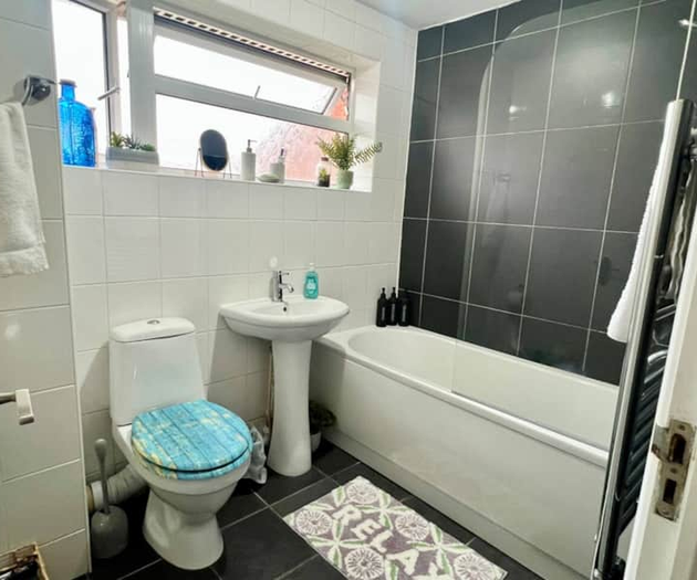 Bathroom - sink, toilet, bath and shower. Towels provided.