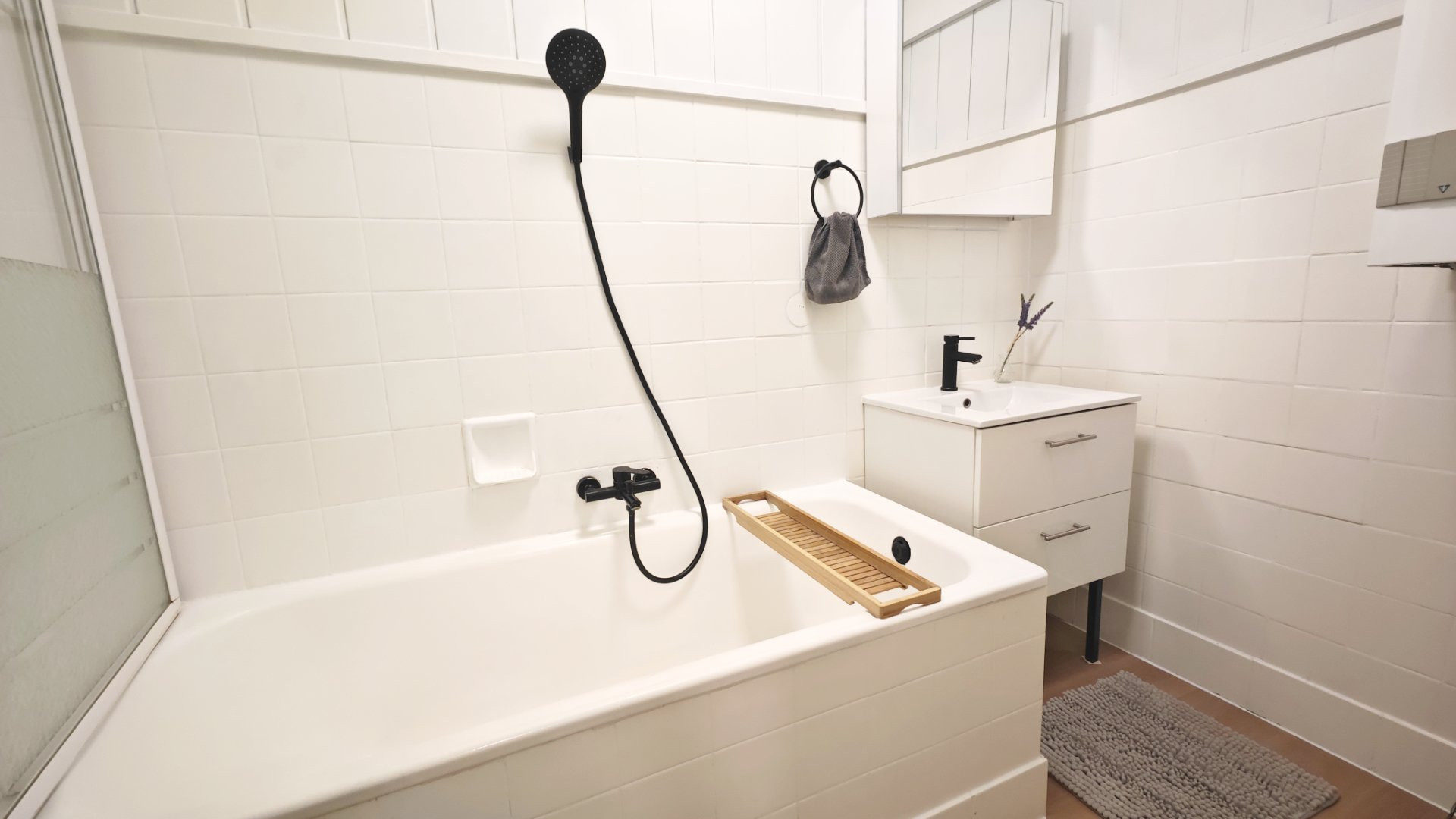 Bright bathroom with bathtub and vanity