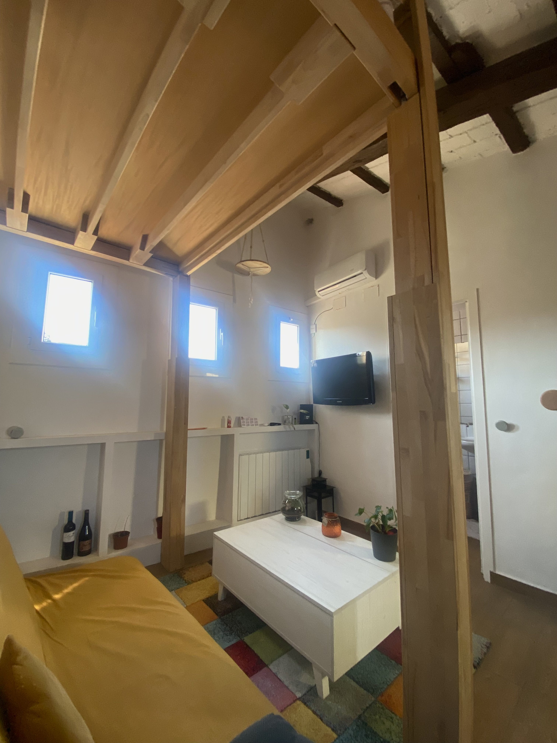 Living area with TV and beams