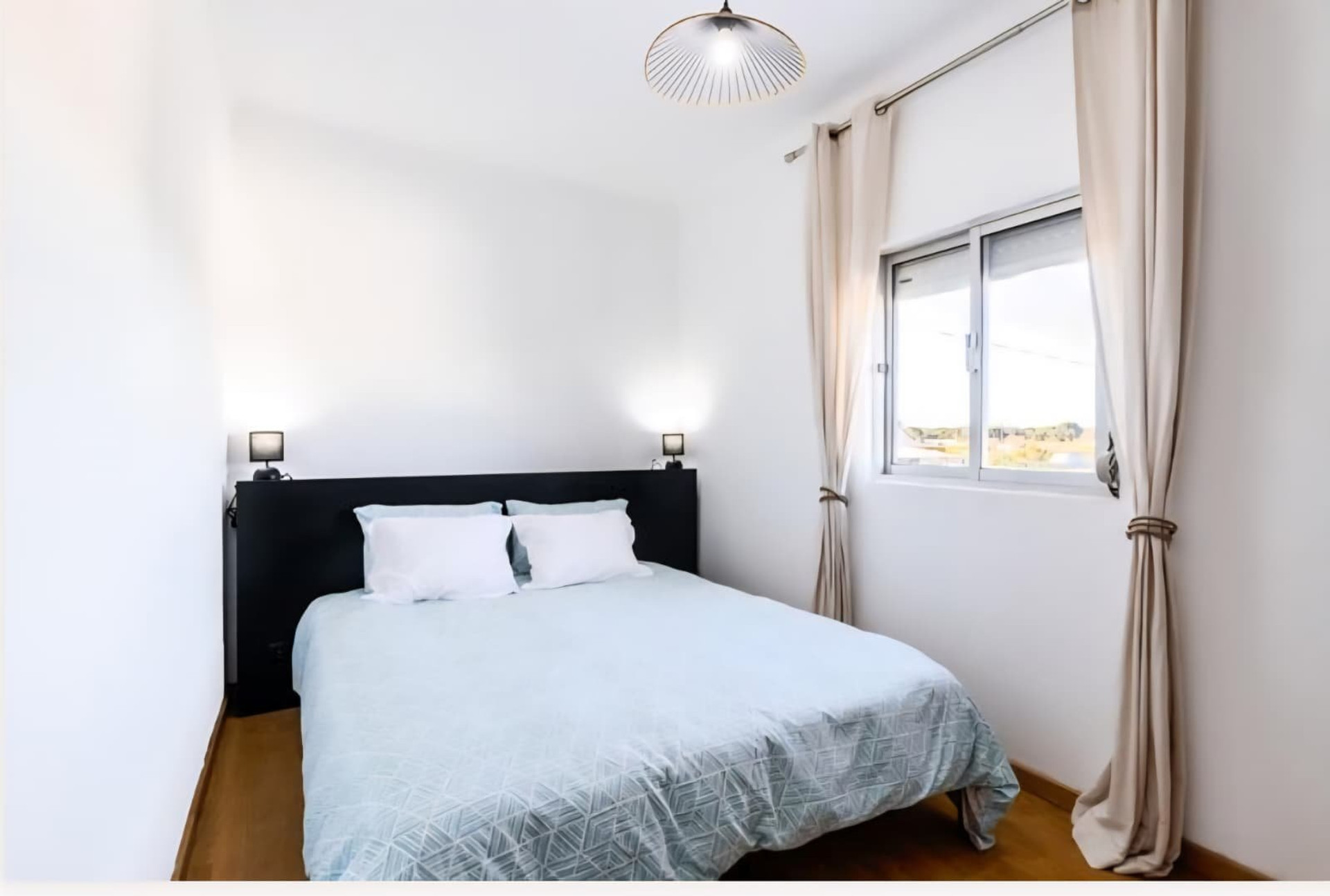 Bedroom with dark headboard