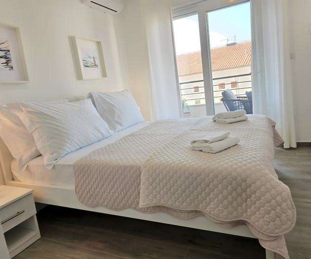 Bedroom with balcony view