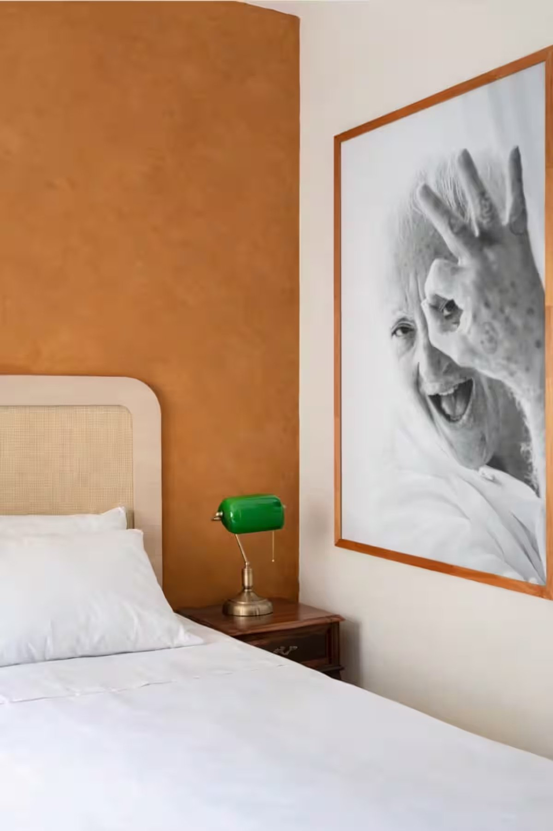 Bedroom with green lamp nightstand