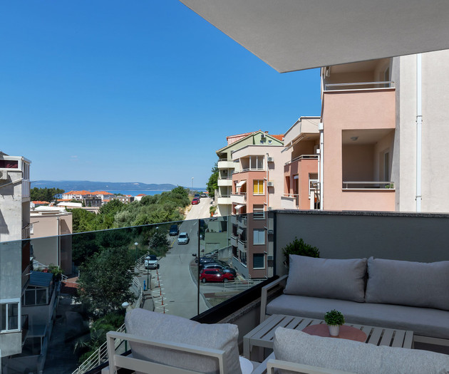 Balcony view over rooftops sea