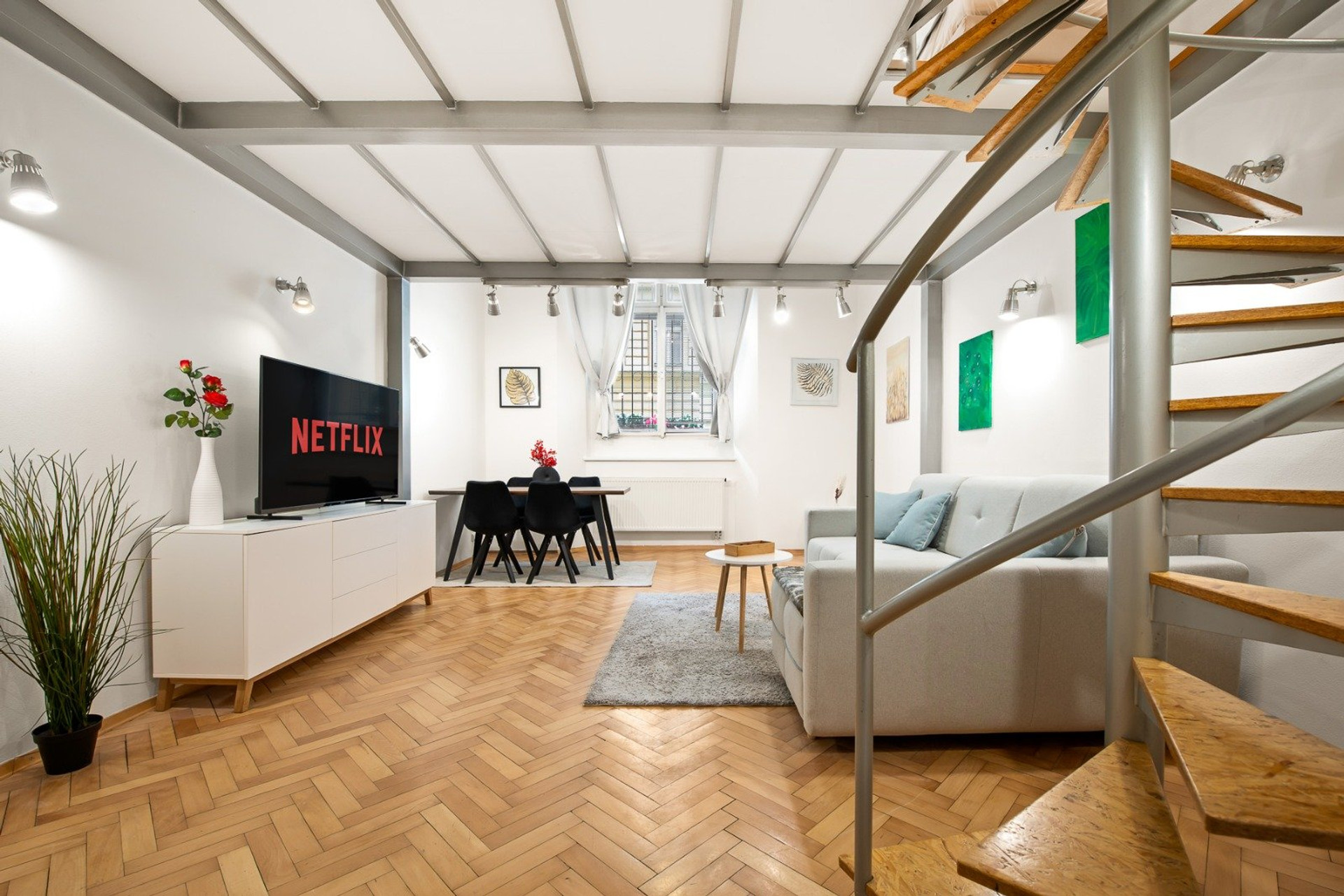 Living room with Netflix TV, staircase