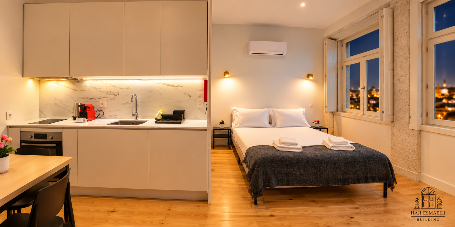 Studio kitchen and bed at dusk