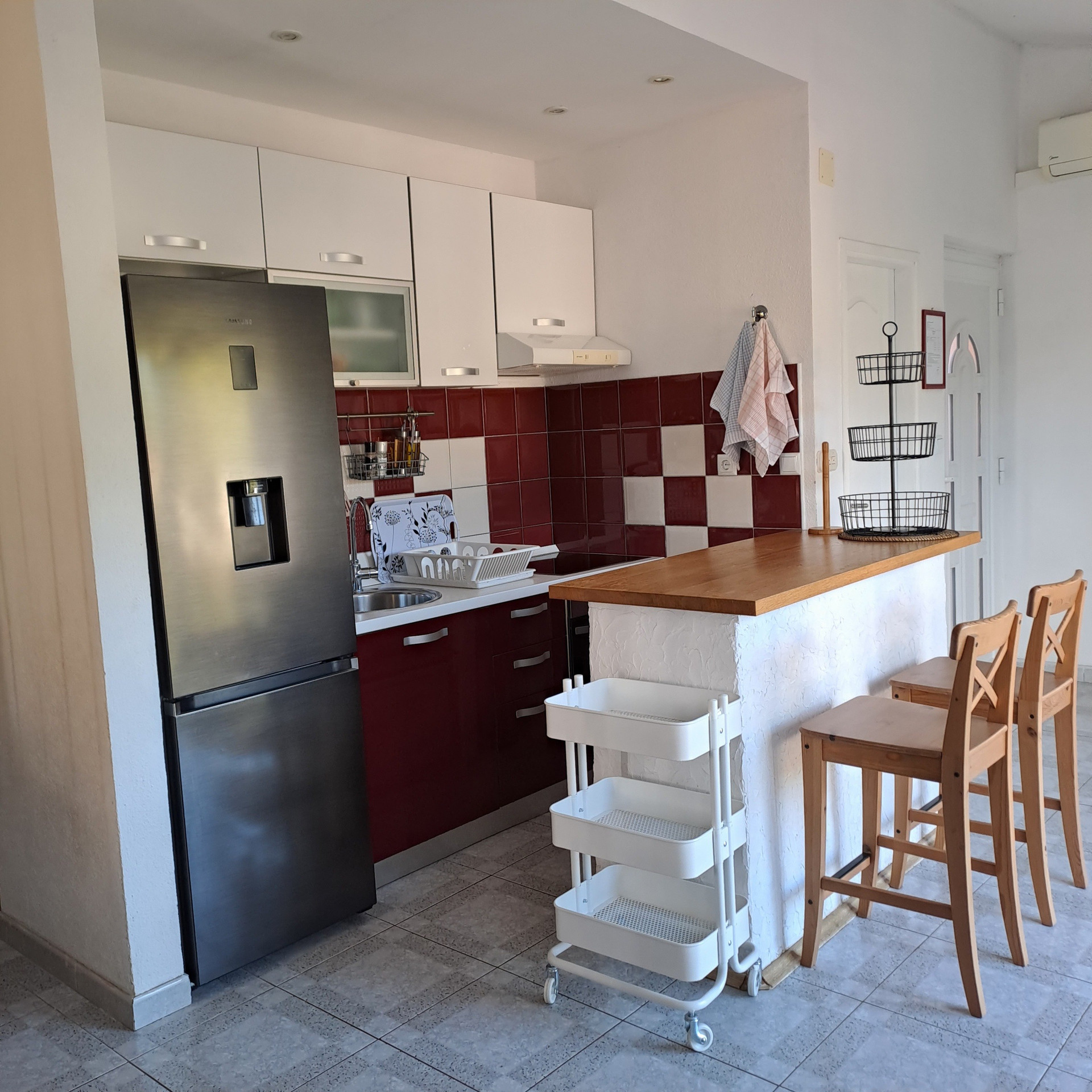 Kitchen with island and bar stools