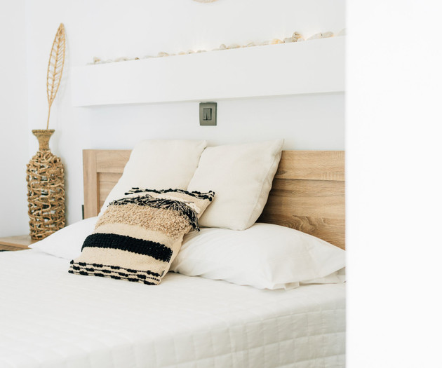 Bed with decorative pillows